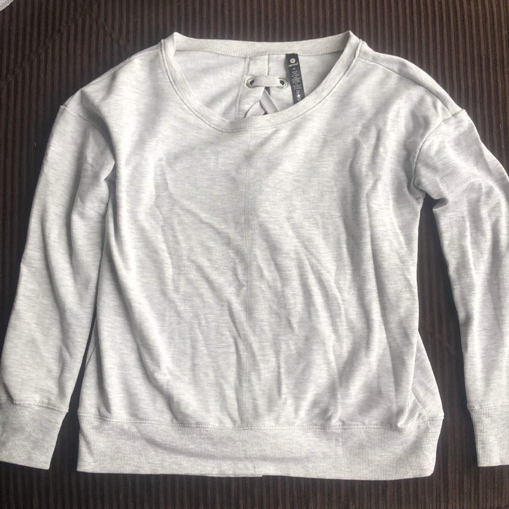 Cute grey sweater with cross cross on back